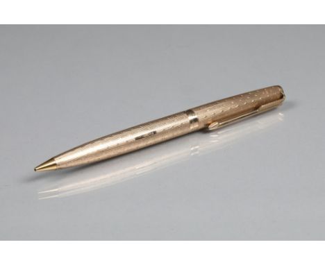 9 carat gold Parker propelling pencil, engine turned decoration, 12.5cm long Pencil is in very good condition. No monograms o