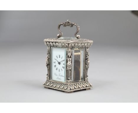 Silver cased carriage clock by Charles Frodsham, London white dial with Roman numerals, bevelled glass, scroll swing handle w
