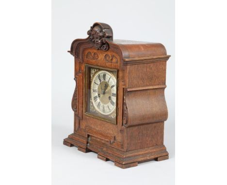 Continental oak cased mantel clock square brass dial silvered chapter ring with black Roman numerals, 42cm high 32.5cm long 1