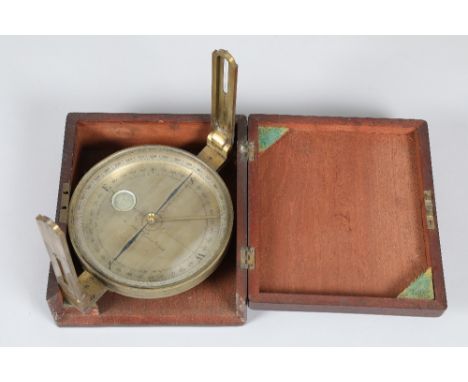 A lacquered brass cased surveyors compass by A Adie, Edinburgh, silvered dial, folding sighting arms, 18cm diameter face in a