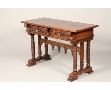 A Renaissance style oak console table rectangular bonded top over two frieze drawers with leaf scroll carving and flanked by 