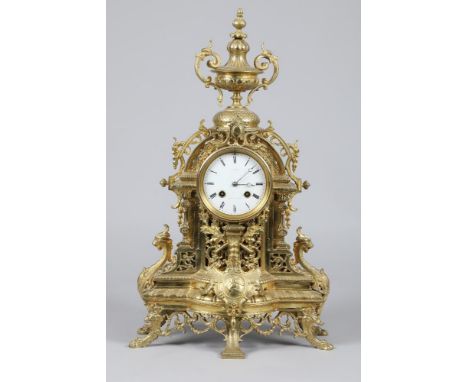 Large French brass ornate mantel clock by Charles Frodsham, circular white dial, Roman numerals, eight day movement in an orn