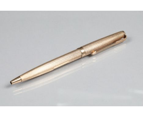 9 carat gold Parker biro pen, engine turned decoration, 12.5cm long Pen is in very good condition. Height surface scratches. 