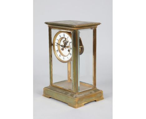 A French gilt brass four glass mantel clock with white enamel dial and Roman numerals, movement stamped HP and Co with pendul