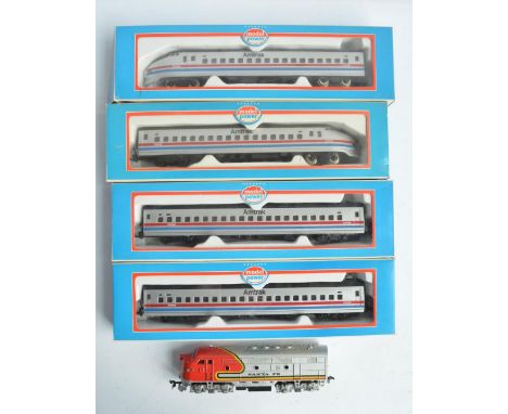 HO gauge Model Power Amtrak bullet train with power and dummy cars plus 2 coaches, all boxed with models in good overall litt