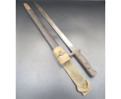 British 1907 pattern bayonet, manufacturer unknown. Complete with original scabbard and canvas belt loop. With considerable r