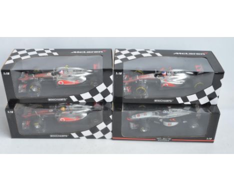 Four boxed 1/18 scale Formula 1 racing car models from Paul's Model Art/Minichamps, all McLaren Mercedes MP4 to include 530 1