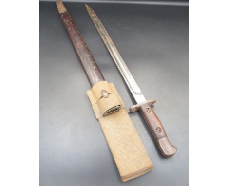 British 1907 pattern bayonet, manufactured by James A. Chapman. Complete with original scabbard and canvas belt loop. With li