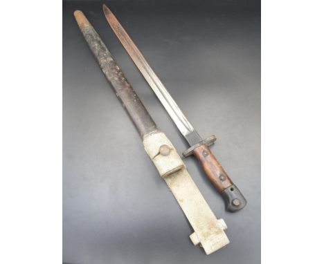 British 1907 pattern bayonet, manufactured by Vickers. Complete with original scabbard and canvas belt loop. With rusting to 