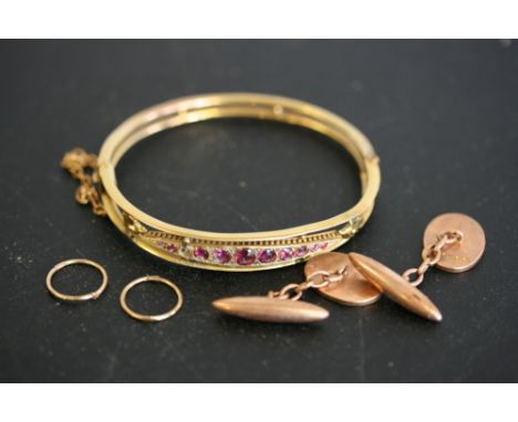 9CT GOLD JEWELLERY - a gold bangle with pink stones (setting for 11 stones, one is missing), a pair of cufflinks and a pair o