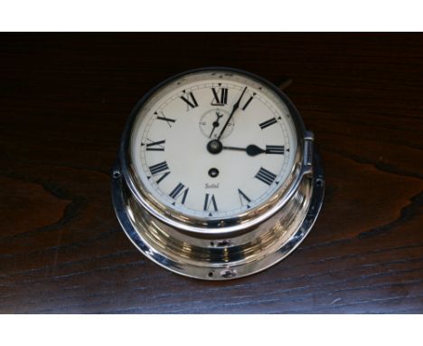 SHIP'S CLOCK - a working ship's clock with Elliott, London movement and a Sestrel dial.