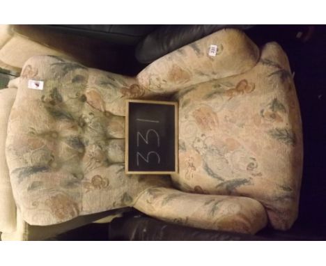 A FINE QUALITY UPHOLSTERED BUTTON BACK ARMCHAIR