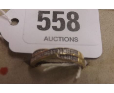 A DIAMOND CROSS OVER RING IN 9ct