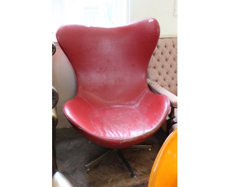 A vintage mid Century wing back leatherette egg chair on chrome base