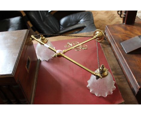 A brass double hanging ceiling light fitting