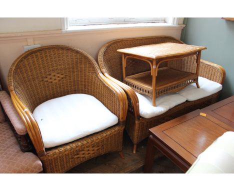 A cane conservatory two seater sofa, single chair and two tier table