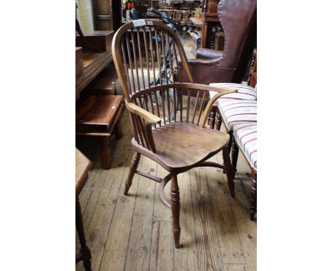 An early 20th Century beech stick back Windsor armchair