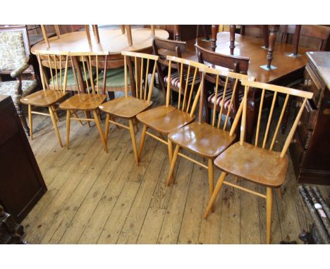 A set of mid Century Ercol beech and elm dining chairs, model 608
