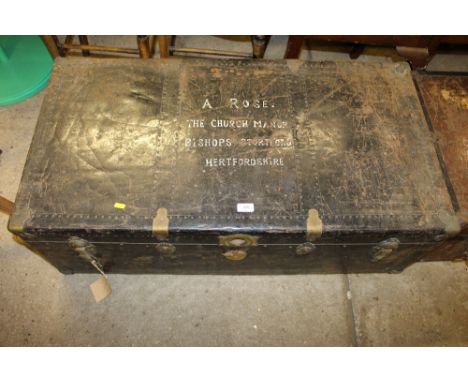 A large metal travelling trunk
