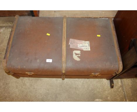A wooden bound travelling trunk