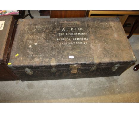 A large metal travelling trunk