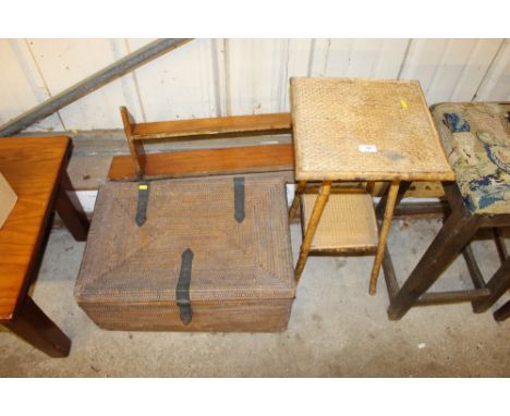 A bamboo two tier table; a small pine wall shelf and a cane work trunk