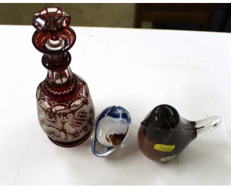 A Wedgwood Art glass paperweight in the form of a bird; a Langham glass egg shaped paperweight and a Victorian ruby glass liq