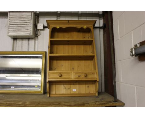 A modern pine wall shelf fitted two drawers