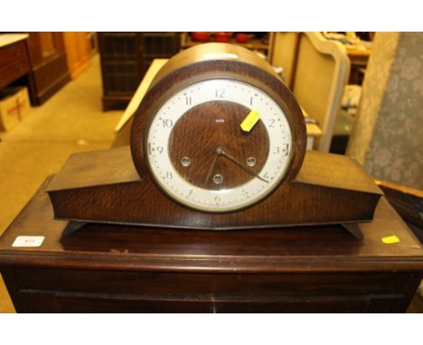 A Smiths oak cased three hole mantel clock