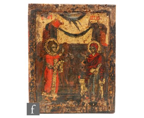 A 17th Century style Russian painted wooden icon of an angelic winged figure offering a sprig of flowers to Christ wearing a 