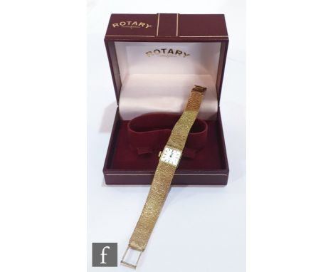 A 9ct hallmarked ladies Rotary wrist watch, batons to a square silvered dial and integral mesh link bracelet. 