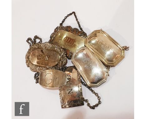 Four hallmarked silver gin decanter labels, with two further plated gin examples, various styles and dates. (6) 