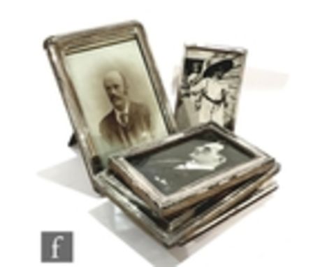 Eight assorted early 20th Century hallmarked silver easel photograph frames of plain form, height of largest 19cm, various st
