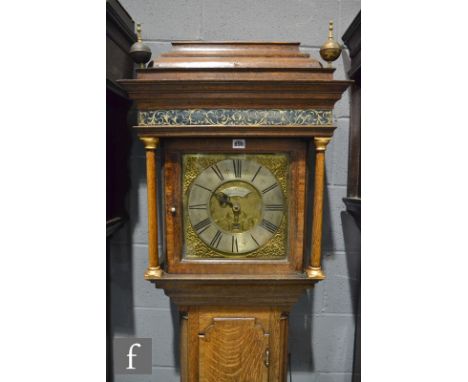 A 19th Century oak thirty hour long case clock brass and silvered dial, marked Sam Whalley, Manchester below stained foliate 