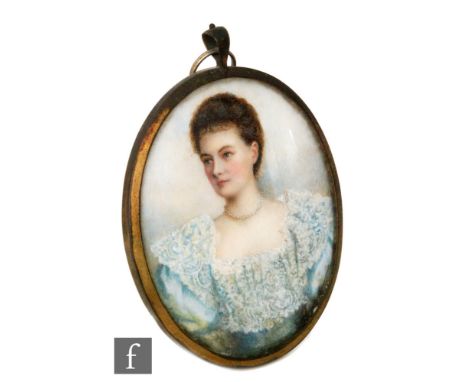 ENGLISH SCHOOL (CIRCA 1870) - Portrait of a young lady wearing a blue dress with lace collar, half length, watercolour on ivo