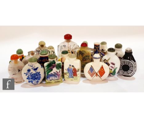 An assorted collection of twenty 20th Century Chinese snuff bottles of varying form to include porcelain examples enamel deco