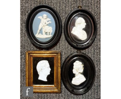A pair of 18th Century relief moulded portrait panels in the manner of Wedgwood depicting King George III and Queen Charlotte