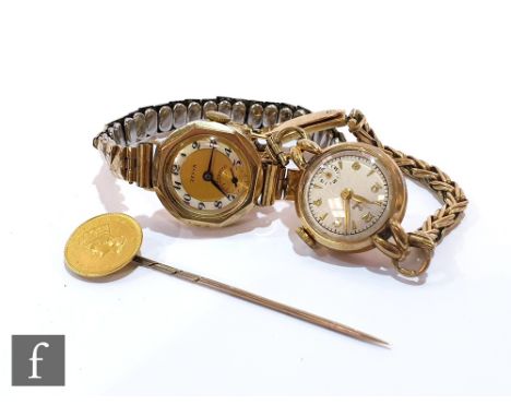 A 9ct hallmarked lady's Tudor wrist watch, Arabic numerals and batons mix to a 9ct bracelet, with a similar example and a one