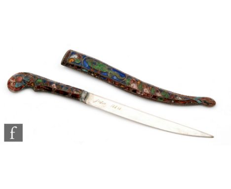 A mid 20th Century champleve enamelled paper knife in the form of a dagger and scabbard decorated with scrolls and dragons, t