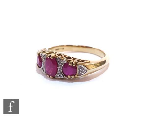 A 9ct hallmarked Edwardian style ruby and diamond boat shaped ring, alternating stones to plain shoulders, ring size N. 