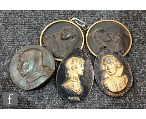 A pair of 19th century cast iron relief plaques depicting Christ and The Virgin Mary, framed, diameter 9.5cm, also one other 