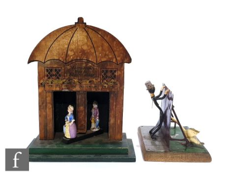 An early 20th Century metal humorous study of a man wearing top hat and tails with a goose and fence between on an oak base, 