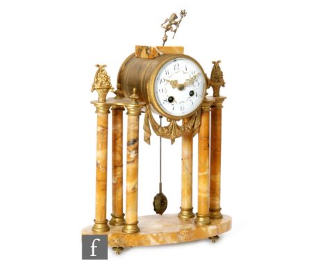 A 19th Century French gilt metal pillar and yellow veined marble mantle clock, white enamelled dial with eight day striking m