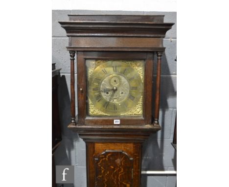 A 19th Century oak eight day strike long case clock, brass dial marked Taylor, Manchester, below caddy top, diameter of dial 