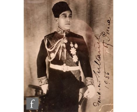 A monochrome photograph depicting a Sultan of Persia dating 1936 in ink, framed, 21.5cm x 17cm, also a monochrome portrait of