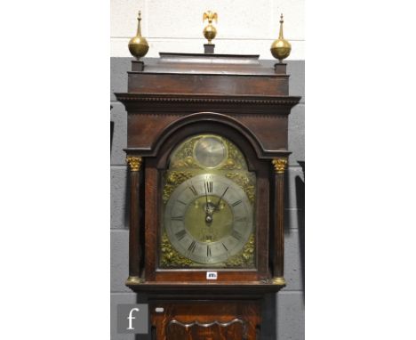 Amended description - A 19th Century oak long case clock with thirty hour movement striking on a bell, brass and silvered dia