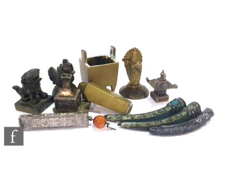 A collection of 19th to 20th Century Chinese and Tibetan metalwork items to include a Chinese silver pagoda chess piece, a ma