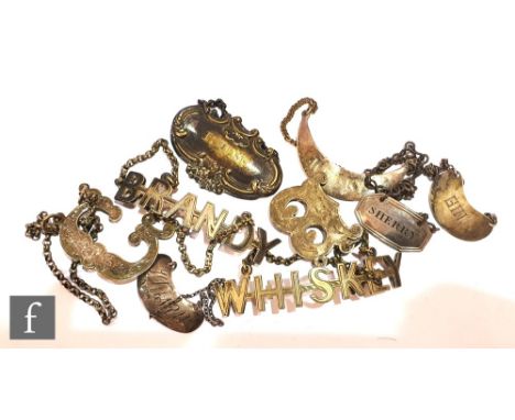 Nine 19th Century and later silver plated decanter labels to include initial and named examples, various styles. (9) 