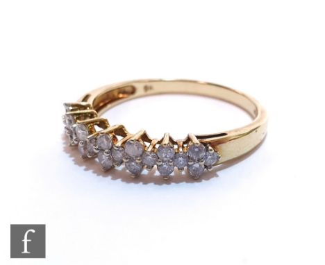 A 9ct hallmarked diamond half eternity ring with pairs of diamonds spaced by single stones, ring size R. 