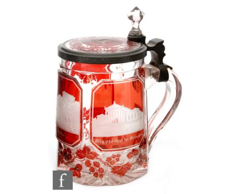 A 19th Century German beer stein cased in ruby and flash cut and engraved with Bavarian landmarks Hohenschwangau, Walhalla an
